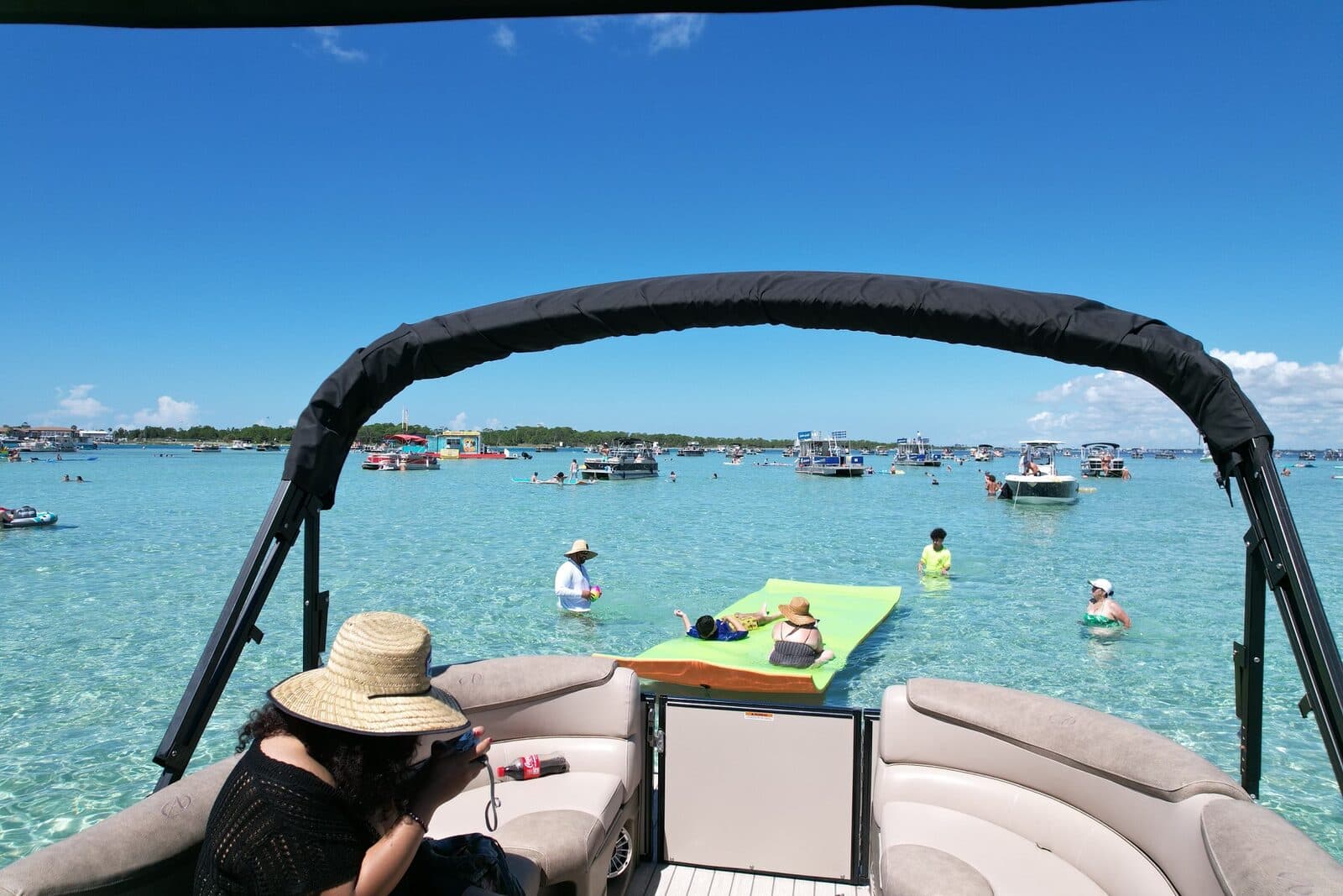 Guests aboard the pontoon looking out to the sandbar
