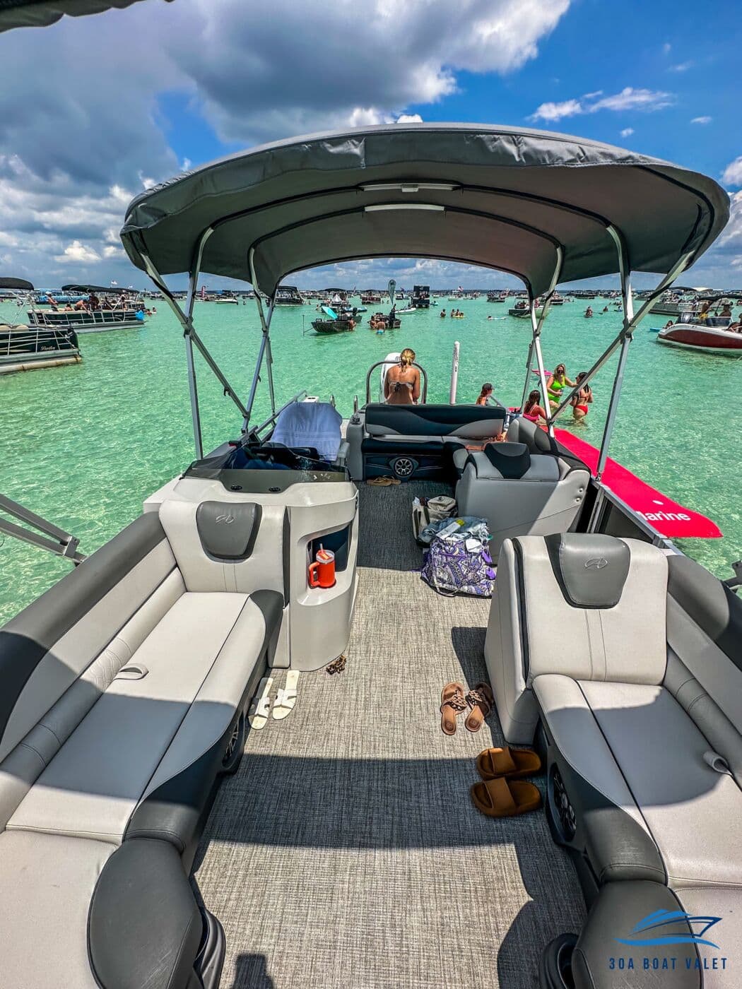 Wraparound lounge seating aboard the luxury tritoon pontoon